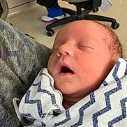 Theo joined the competition — help win amazing prizes! newborn, baby, sleeping, blanket, zigzag_pattern, indoor, person, nose_ring, face, closeup, soft, wrapped, comfort, peaceful, infant, child, toddler, human, portrait, care