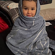 Adelyn joined the competition — help win amazing prizes! baby, blanket, clothing, couch, face, fashion, furniture, happy, hat, head, hood, hoodie, knitwear, person, photography, portrait, smile, sweater, sweatshirt, towel