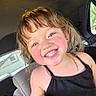 child, smiling, car_interior, black_tank_top, necklace, happy, rosy_cheeks, young_girl, portrait, seat, window, daylight, cute, person, hair, face, bright_eyes, casual_clothing, indoors, childhood
