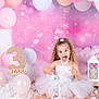 child, girl, birthday, balloons, pink, white, tutu, celebration, number_three, party, decorations, lantern, playful, happy, smiling, sparkles, curly_hair, background, floor, studio