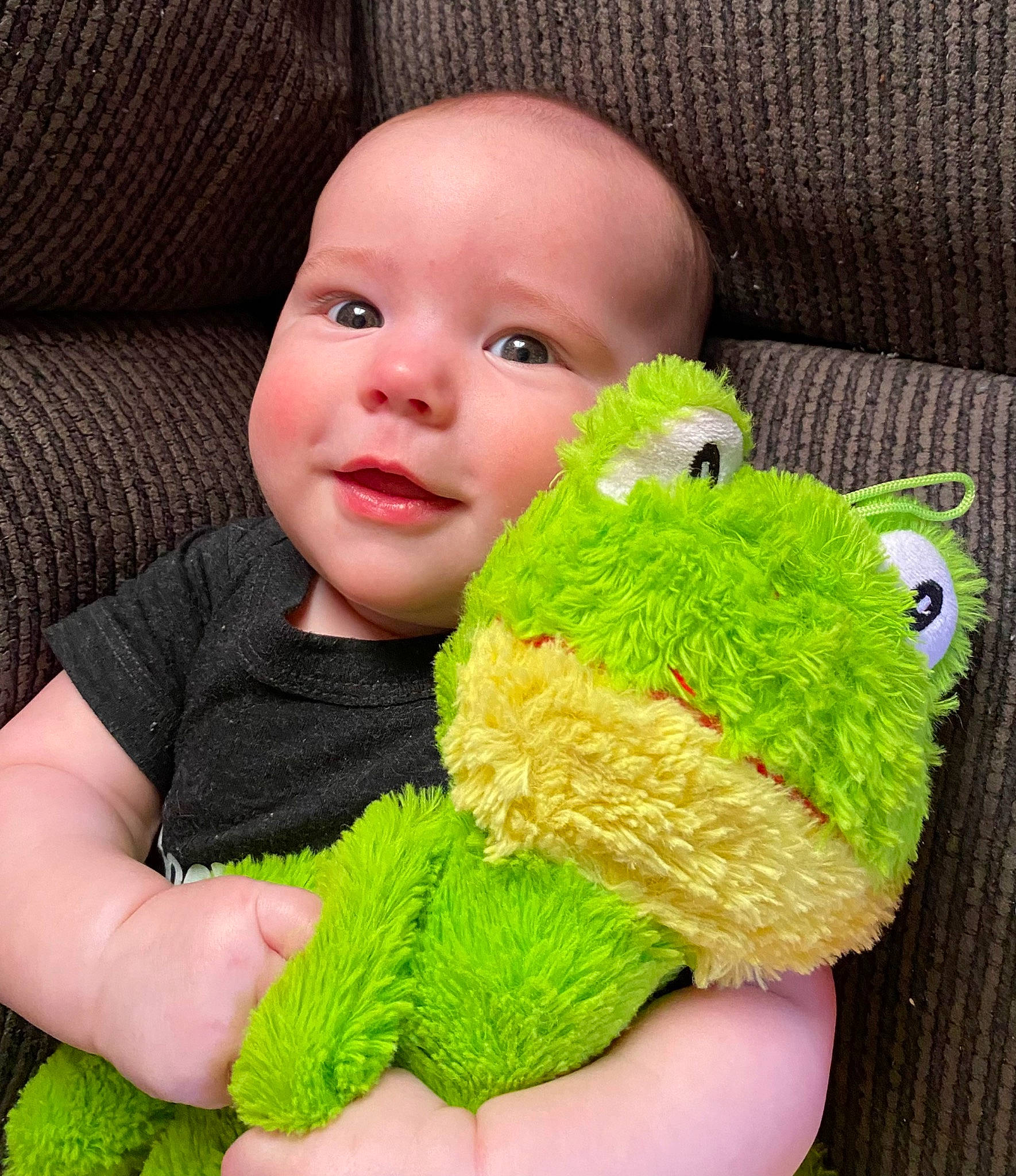 Brenden is registered to the contest to win money with this photo: art, baby, baby_toddler_clothing, child, comfort, craft, grass, green, happy, pattern, person, plush, skin, sleeve, smile, stuffed_toy, textile, thumb, toddler, wool
