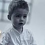 background_blur, boy, casual_clothing, child, closeup, contemplative, emotion, expression, face, indoor, monochrome, person, portrait, sad, short_hair, skin, soft_light, tear, white_shirt, young