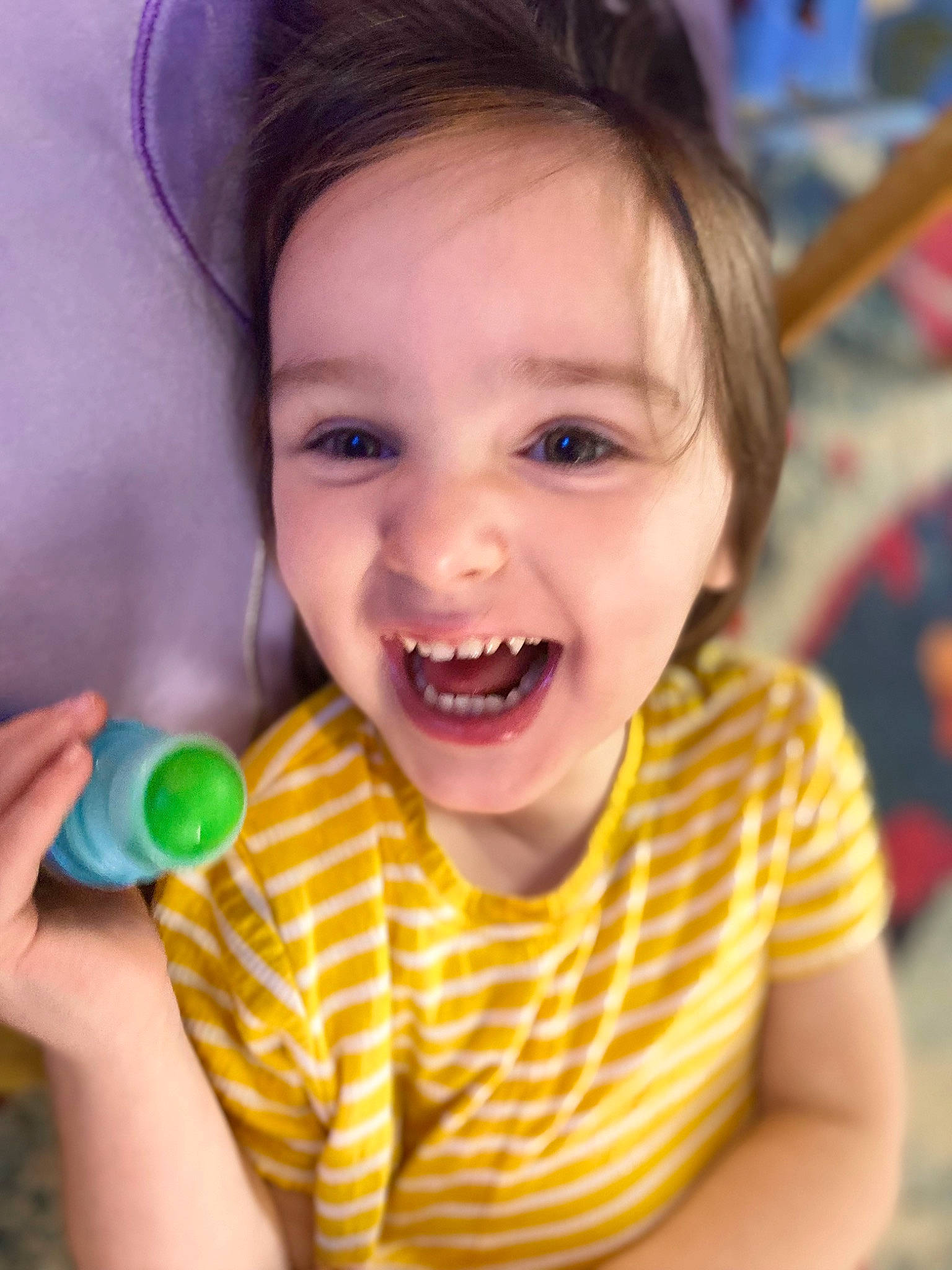 Ava joined the competition — help win amazing prizes! audio_equipment, cheek, child, facial_expression, finger, fun, gesture, grass, happy, hard_candy, joy, lip, microphone, mouth, nose, organ, person, skin, smile, thumb