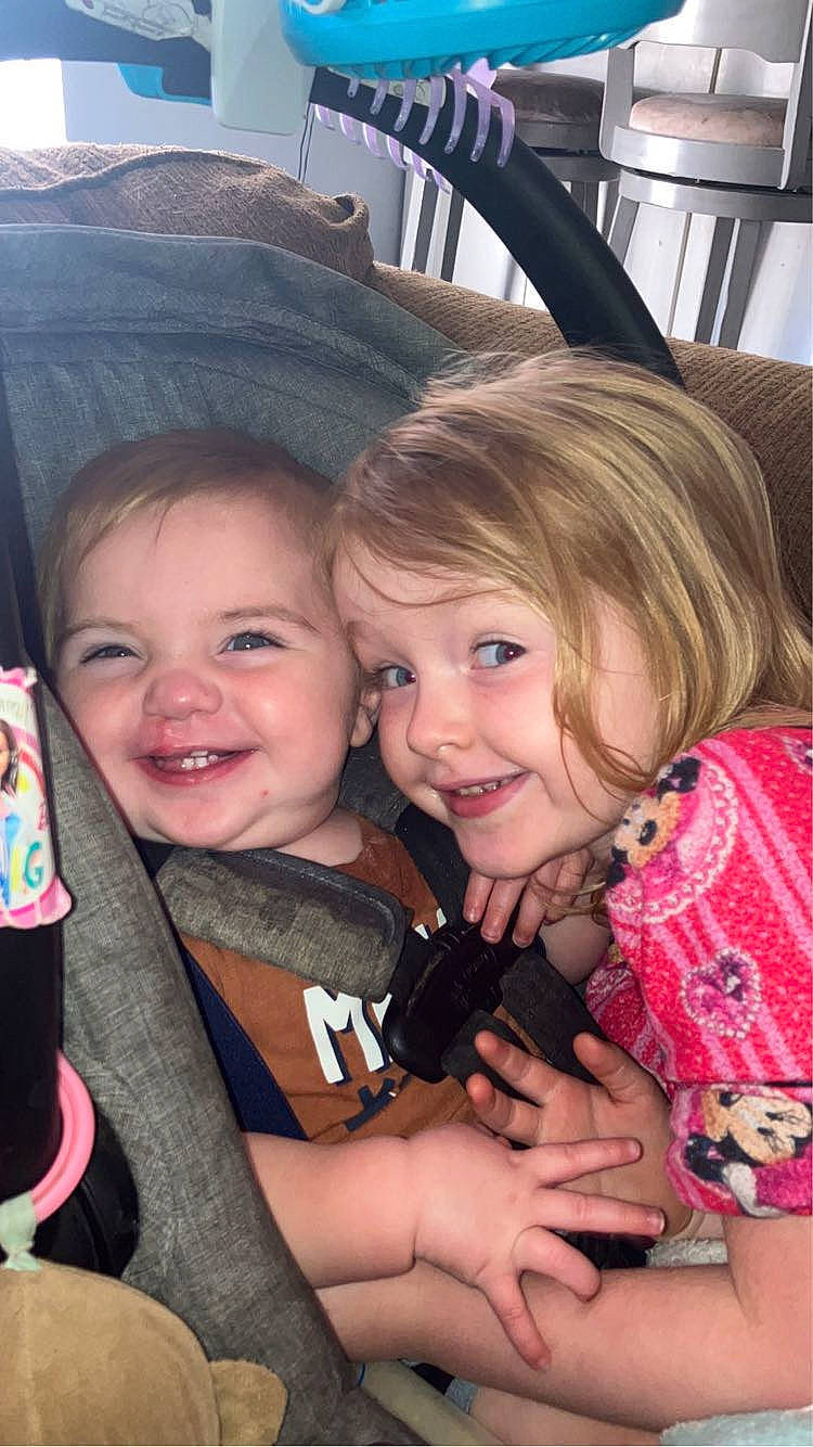 Braxten is registered to the contest to win money with this photo: blond, cheek, child, comfort, event, finger, fun, gesture, hand, happy, iris, joy, laugh, nail, person, sitting, skin, smile, thumb, toddler