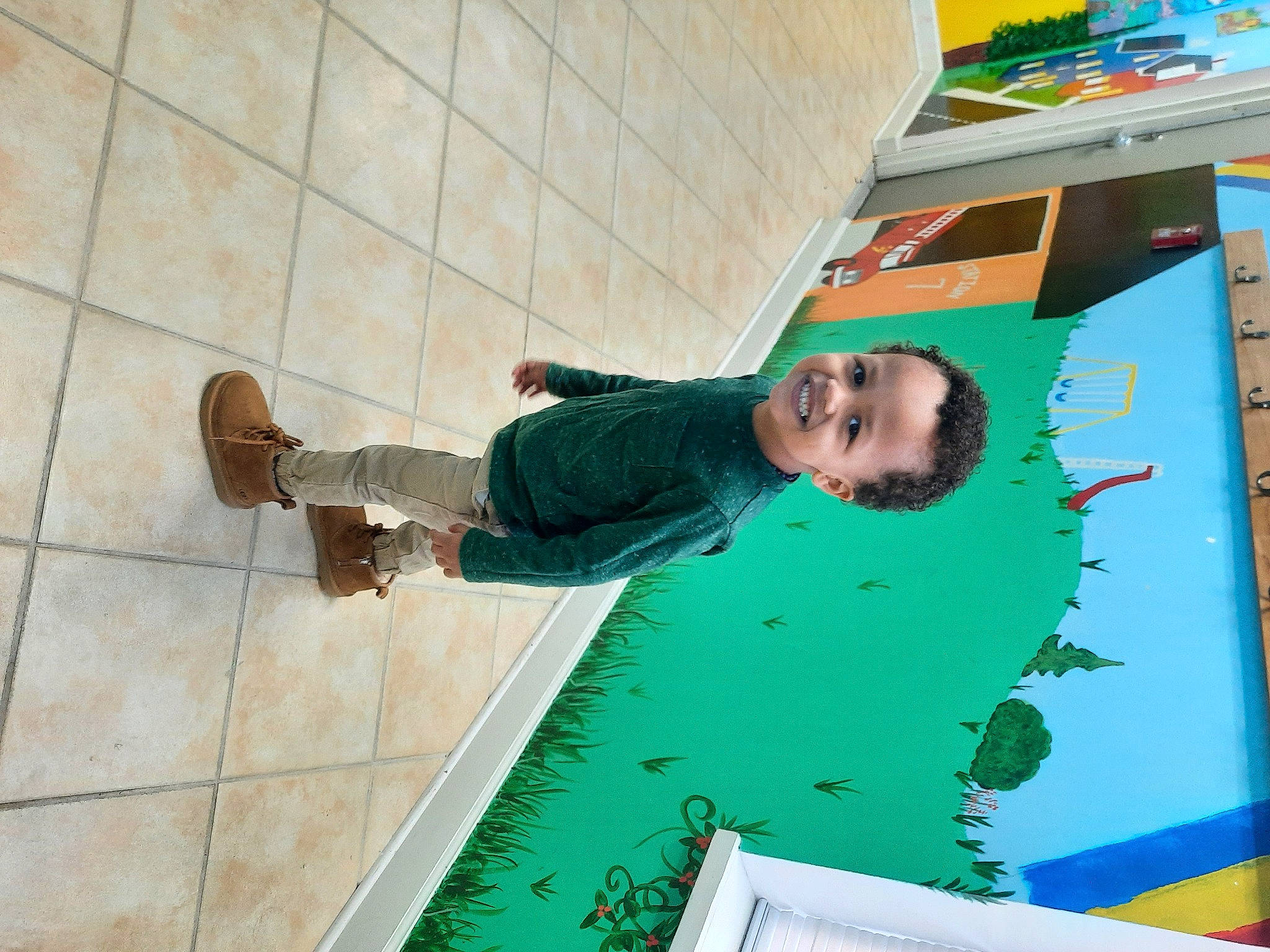 Kobe joined the competition — help win amazing prizes! art, child, floor, flooring, font, foot, fun, grass, green, hardwood, joy, leisure, pattern, person, plant, play, recreation, room, smile, toddler