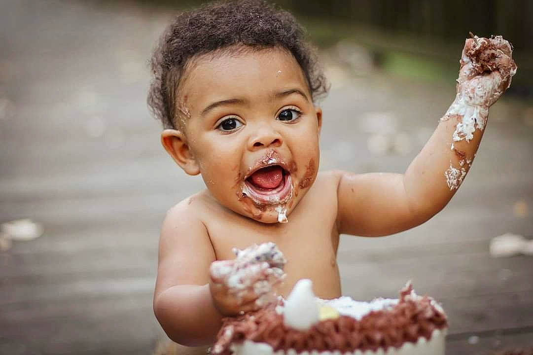 Julius is registered to the contest to win money with this photo: baby, child, dessert, event, face, finger, flash_photography, fun, gesture, happy, ingredient, laugh, leisure, lip, people_in_nature, person, portrait_photography, skin, smile, surprise