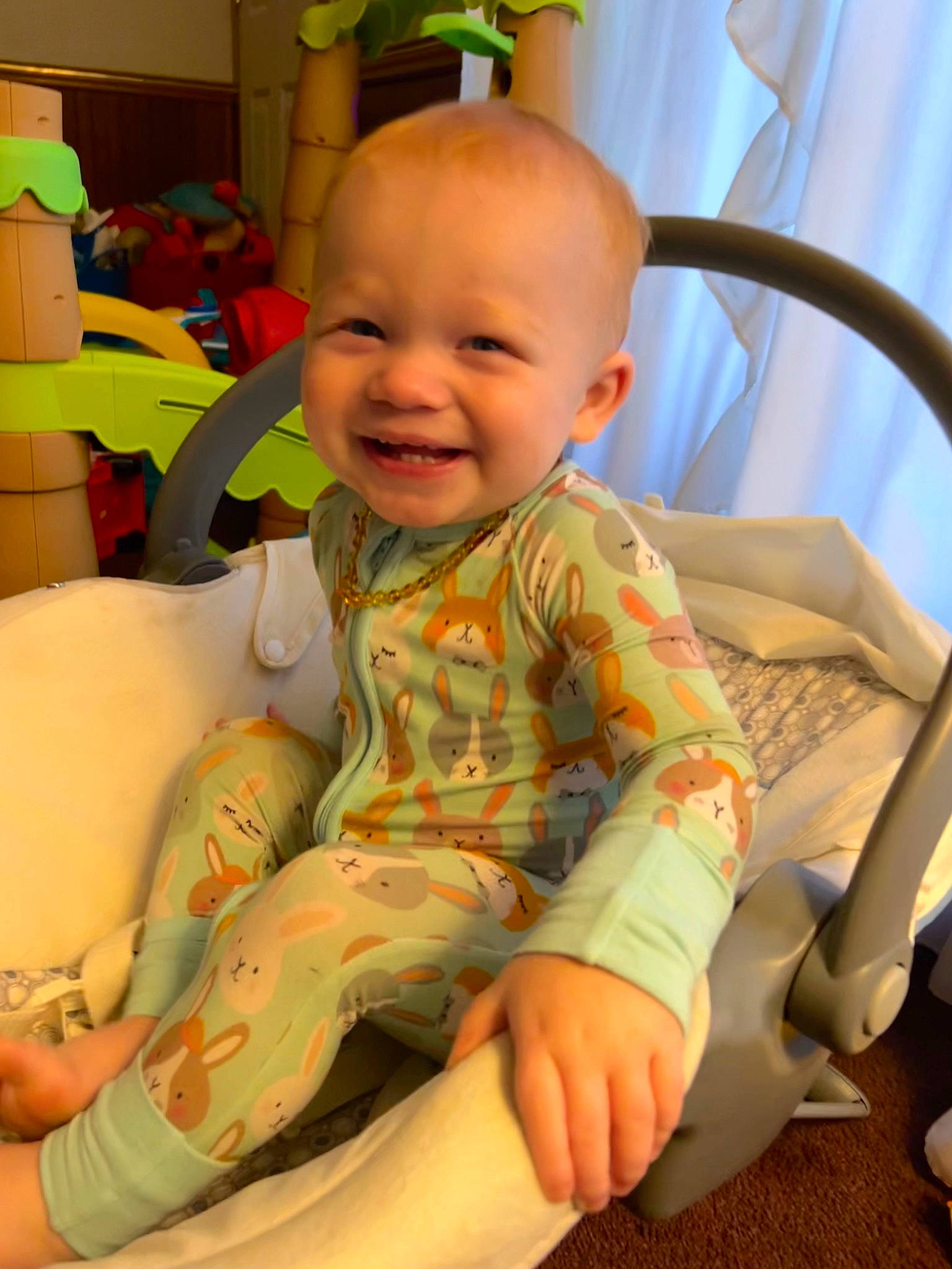 Karsyn is registered to the contest to win money with this photo: baby, baby_toddler_clothing, cheek, child, comfort, flooring, fun, happy, head, human_body, human_leg, joy, lap, mouth, person, room, sitting, skin, smile, thigh