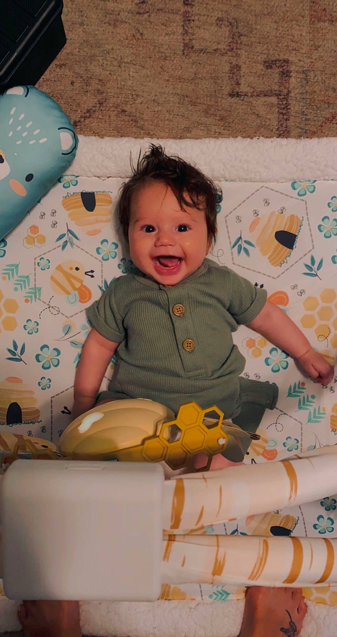 Brooks is registered to the contest to win money with this photo: arm, baby, baby_toddler_clothing, balloon, child, comfort, face, facial_expression, fun, happy, head, leisure, person, product, skin, smile, t_shirt, textile, toddler, toy