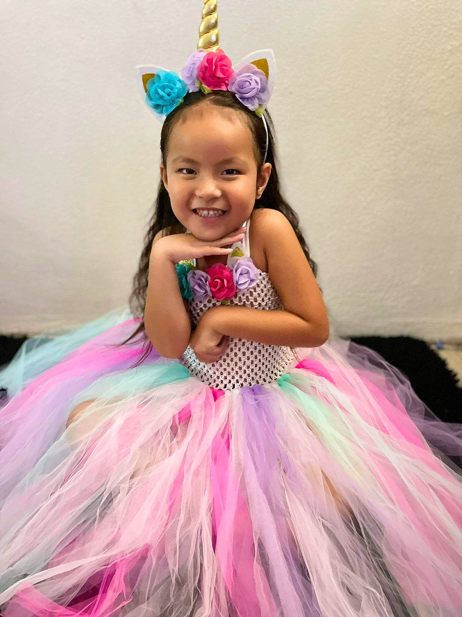 Riley a rejoint le concours — aidez-le/la à gagner de superbes lots ! ballet_tutu, child, dress, event, facial_expression, fashion_design, feather, formal_wear, fun, hairstyle, happy, headgear, headpiece, jewellery, joy, magenta, person, pink, purple, ruffle