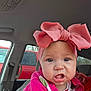 Serenity joined the competition — help win amazing prizes! baby, infant, bow_headband, pink_bow, headband, car_interior, vehicle_window, car_seat, seatbelt, close_up, portrait, eyes, cheeks, face, expression, clothing, pink_sweater, hand, adult_arm, parking_lot