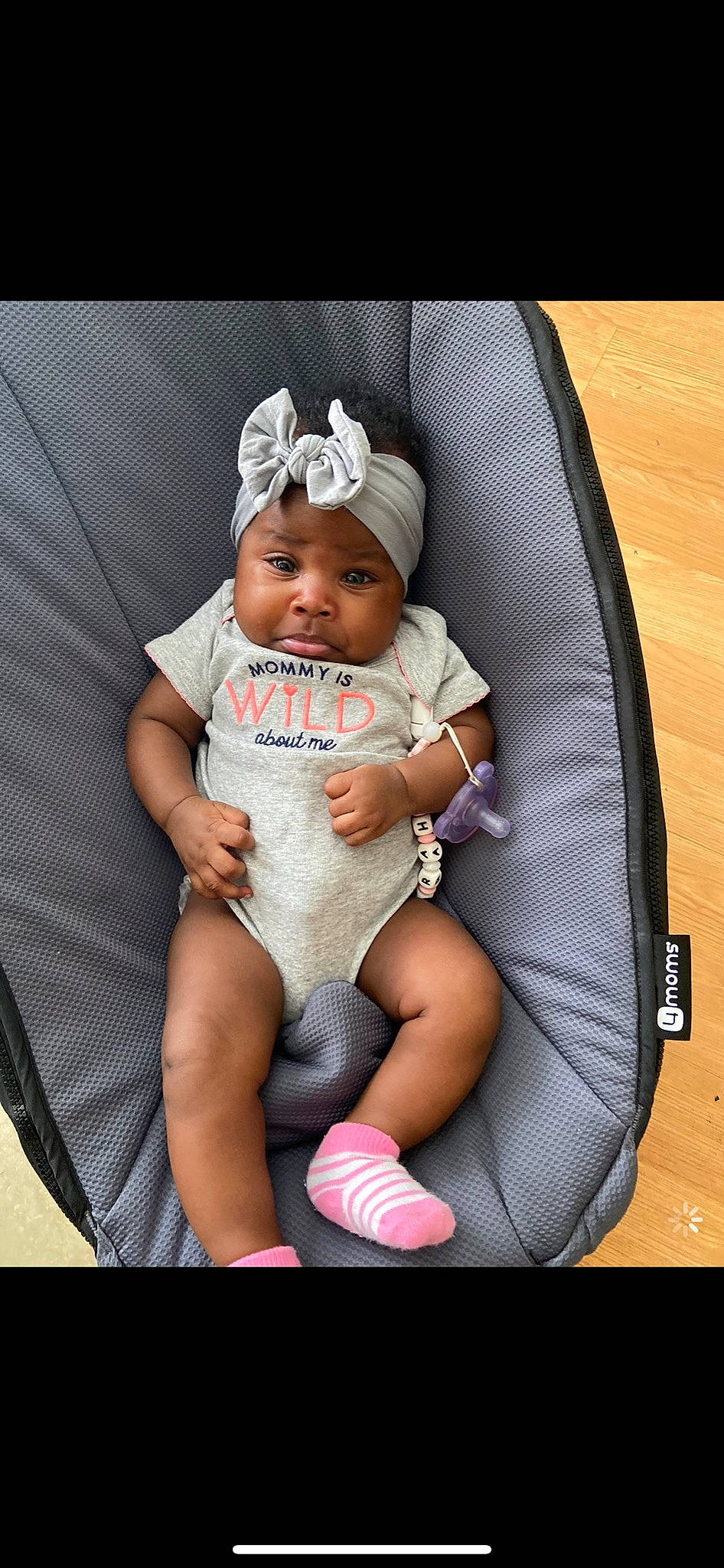 Samirah is registered to the contest to win money with this photo: baby, baby_carriage, baby_products, baby_toddler_clothing, cap, child, comfort, fashion_accessory, finger, foot, happy, headwear, human_leg, jewellery, lap, pattern, person, pink, sitting, thigh