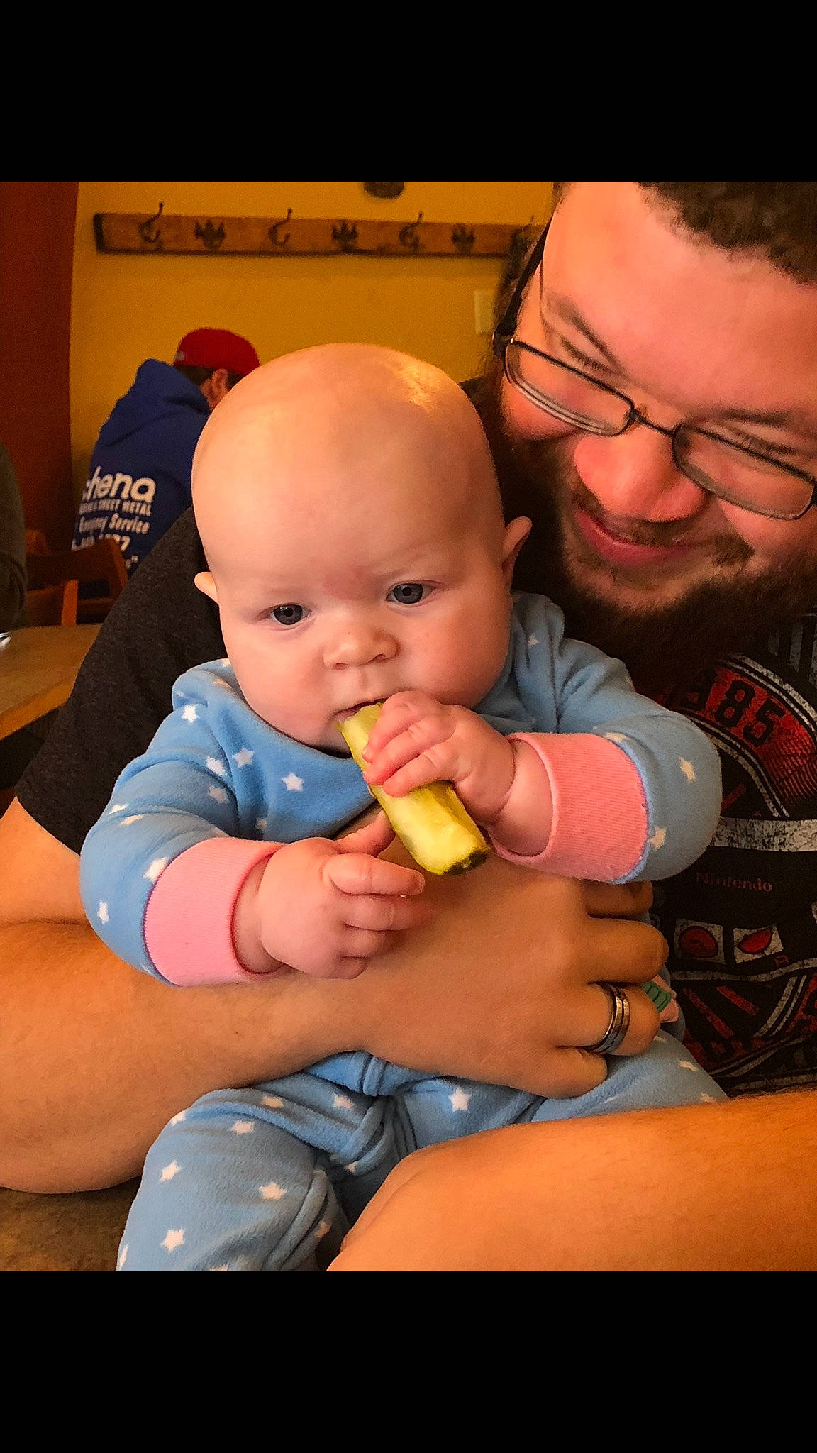 Noella is registered to the contest to win money with this photo: baby, cheek, child, eating, father, finger, person, skin, thumb, toddler