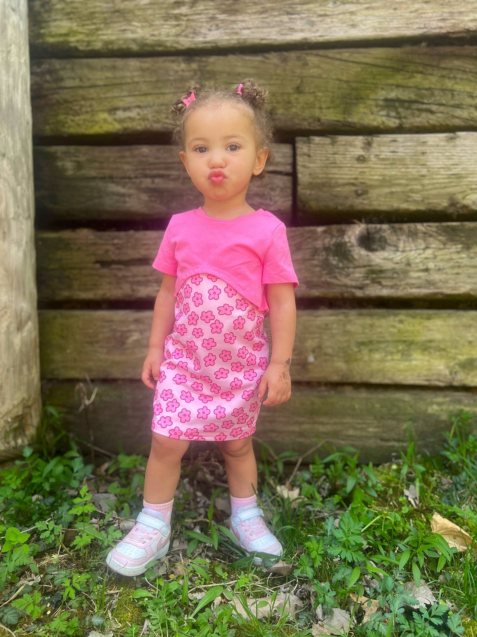 Jesslyn is registered to the contest to win money with this photo: baby_toddler_clothing, child, eye, fawn, grass, grass_family, hair, happy, head, human_body, leaf, magenta, people_in_nature, person, pink, plant, skin, sleeve, t_shirt, waist