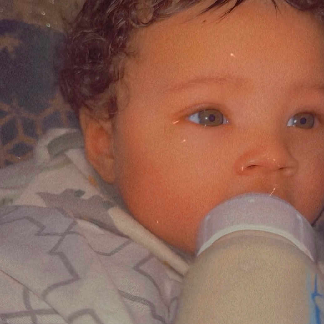 Vontray joined the competition — help win amazing prizes! baby, blanket, bottle, child, close_up, comfort, curly_hair, cute, expression, face, feeding, indoors, infant, peaceful, portrait, sleepy, soft_lighting, warm_colors, wrapped, young_child