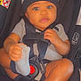 baby, baby_clothes, baby_gear, car_seat, child, clothing, cute, foot, hat, headwear, indoor, infant, person, portrait, safety, seat, seatbelt, smiling, sock, straps