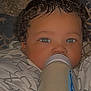 Vontray is registered to the contest to win money with this photo: baby, blanket, blue_eyes, bottle, child, closeup, curly_hair, cute, face, feeding, indoors, infant, milk, newborn, person, portrait, resting, sleepy, soft_light, warm
