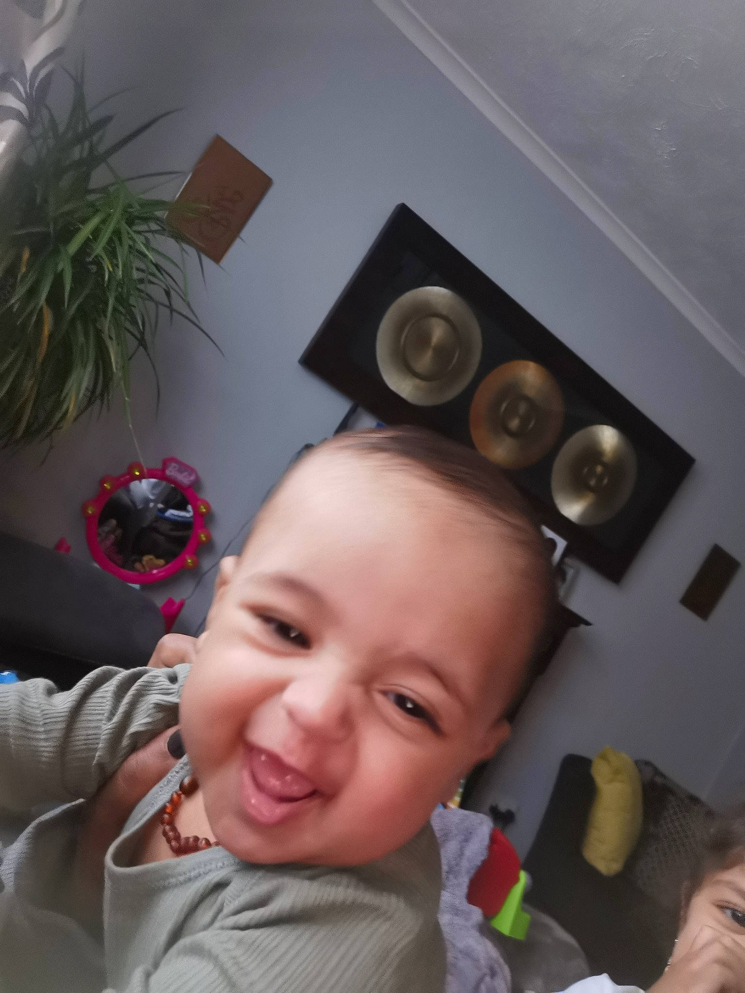 Izayah is registered to the contest to win money with this photo: audio_equipment, baby, child, eyelash, eyewear, flash_photography, fun, happy, houseplant, loudspeaker, person, plant, room, selfie, sitting, smile, studio_monitor, subwoofer, toddler, toy