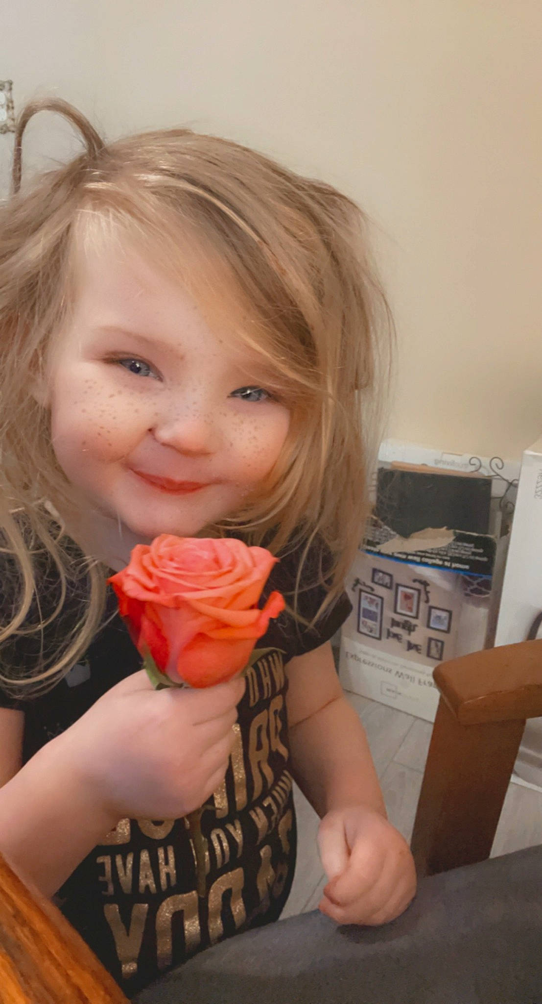 Aspen is registered to the contest to win money with this photo: box, brown_hair, cheek, child, eyelash, finger, food, happy, joy, lip, nail, person, plant, rose, rose_family, rose_order, shipping_box, shorts, smile, sweetness