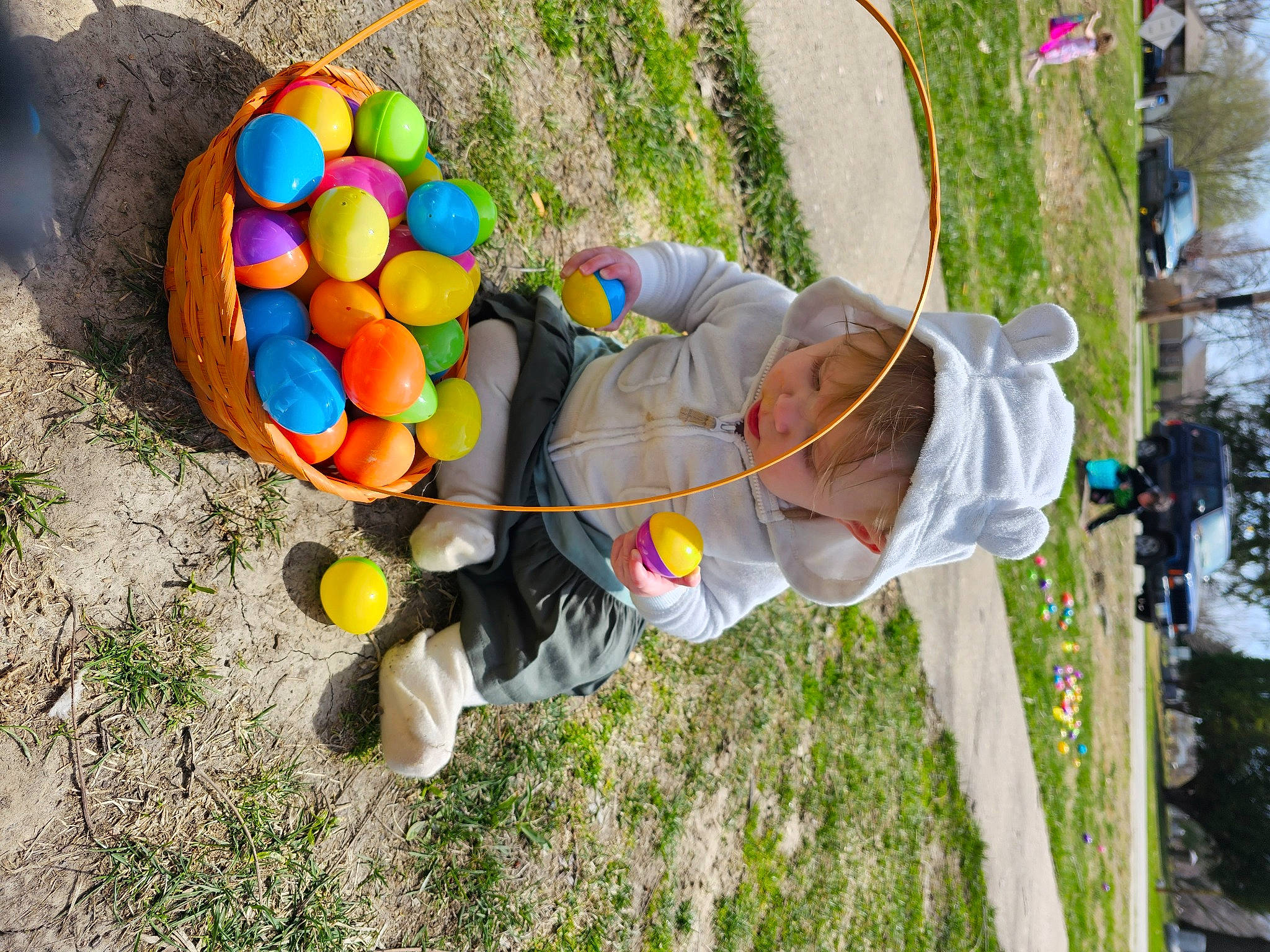 Estella is registered to the contest to win money with this photo: baby, ball, balloon, child, easter, event, fun, grass, happy, hat, leisure, people_in_nature, person, plant, plastic, play, recreation, soil, toddler, toy