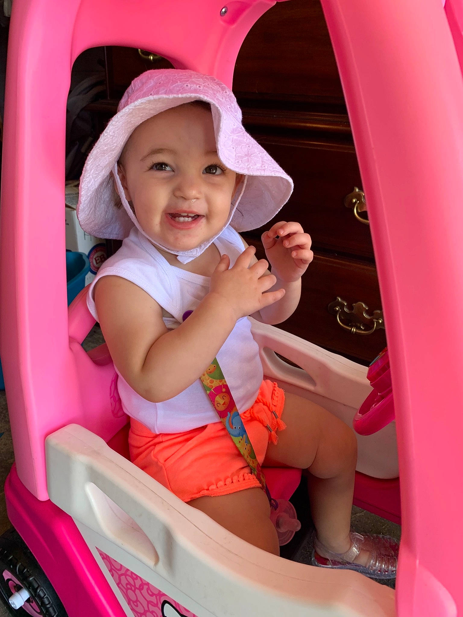 Makenna joined the competition — help win amazing prizes! baby_products, car, car_seat, child, fun, happy, leisure, luxury_vehicle, person, pink, play, product, red, skin, smile, toddler, vacation, vehicle