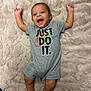Kameron joined the competition — help win amazing prizes! baby, infant, child, smiling, happy, lying_down, onesie, clothing, text_on_clothing, beige_rug, soft_texture, barefoot, cute, arms_up, open_mouth, indoors, floor, carpet, person, portrait