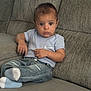 Kameron joined the competition — help win amazing prizes! child, baby, couch, clothing, jeans, socks, tshirt, nike, indoor, person, seated, furniture, casual, denim, portrait, young_child, living_room, serious_expression, comfortable, fashion