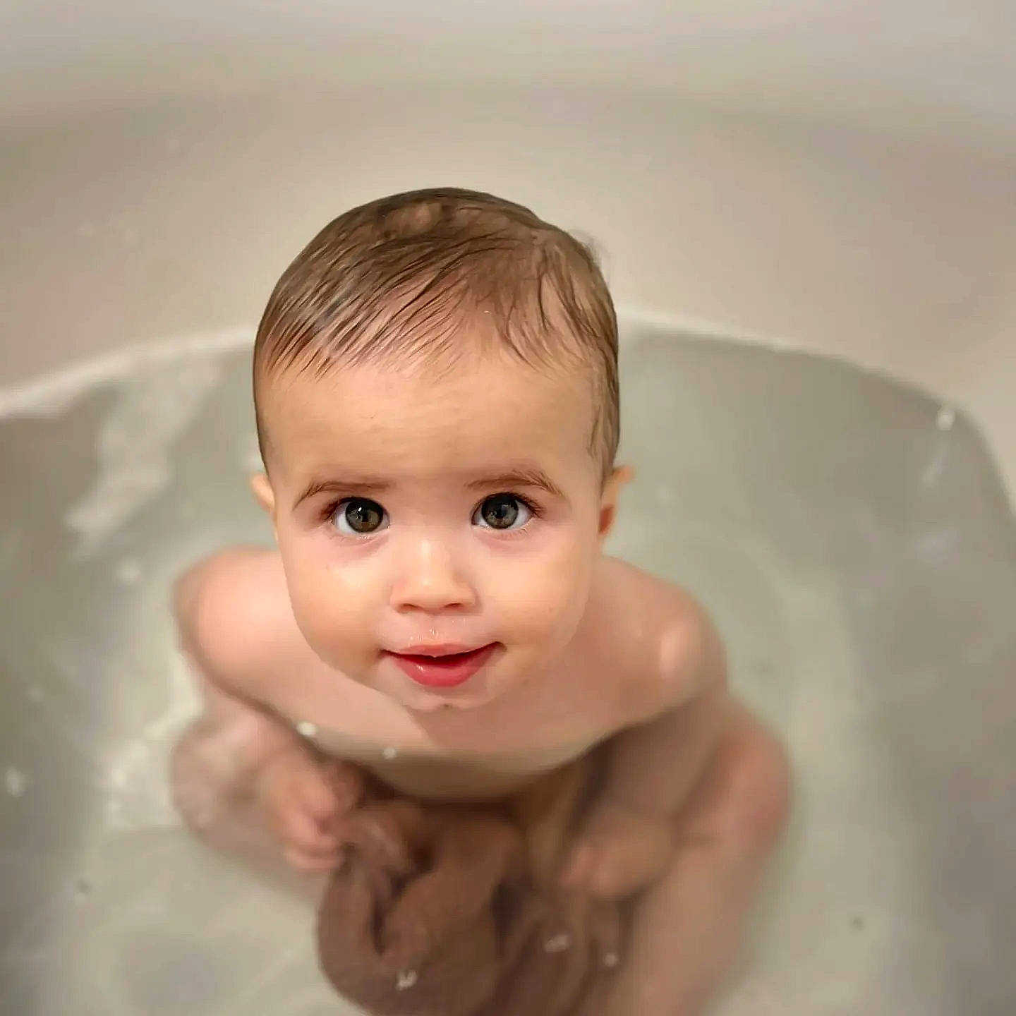 Hank is registered to the contest to win money with this photo: baby, baby_bathing, bathing, bathroom, bathtub, cheek, chest, child, eyelash, fluid, foam, fun, hand, happy, human_body, liquid, person, plumbing, smile, toddler