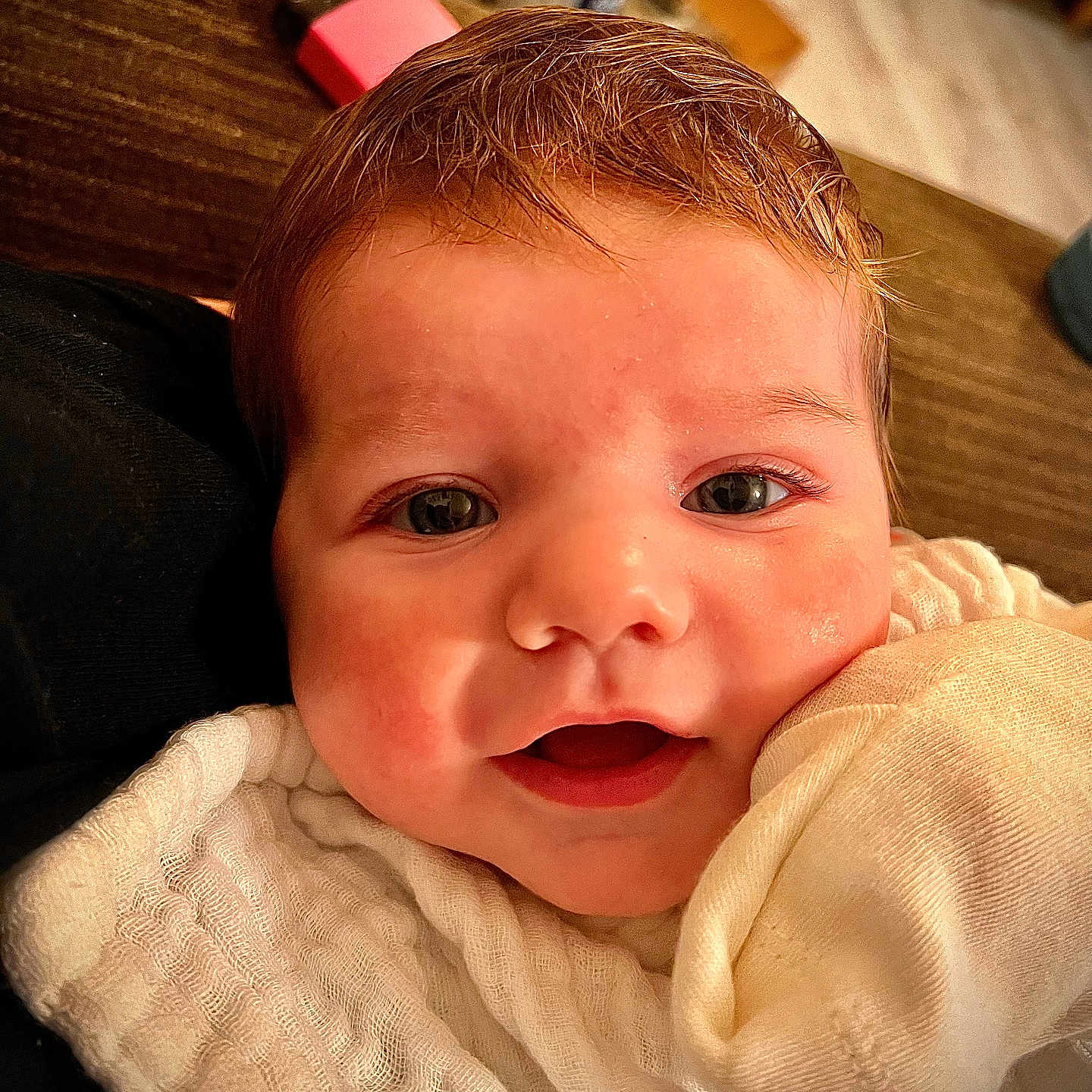 Sienna is registered to the contest to win money with this photo: baby, bodypart, couch, face, finger, furniture, hand, happy, head, laughing, mouth, newborn, person, photography, portrait, selfie, smile, teeth, towel, wood