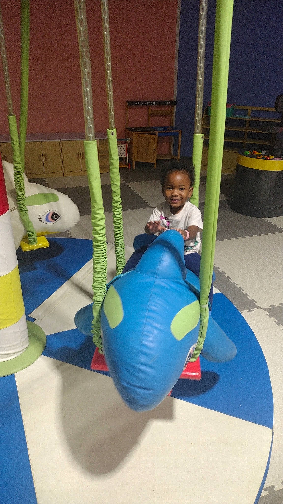 Layla joined the competition — help win amazing prizes! baby, child, city, electric_blue, fun, green, joy, leisure, outdoor_play_equipment, person, plastic, play, playground, recreation, shorts, smile, t_shirt, toddler, yellow