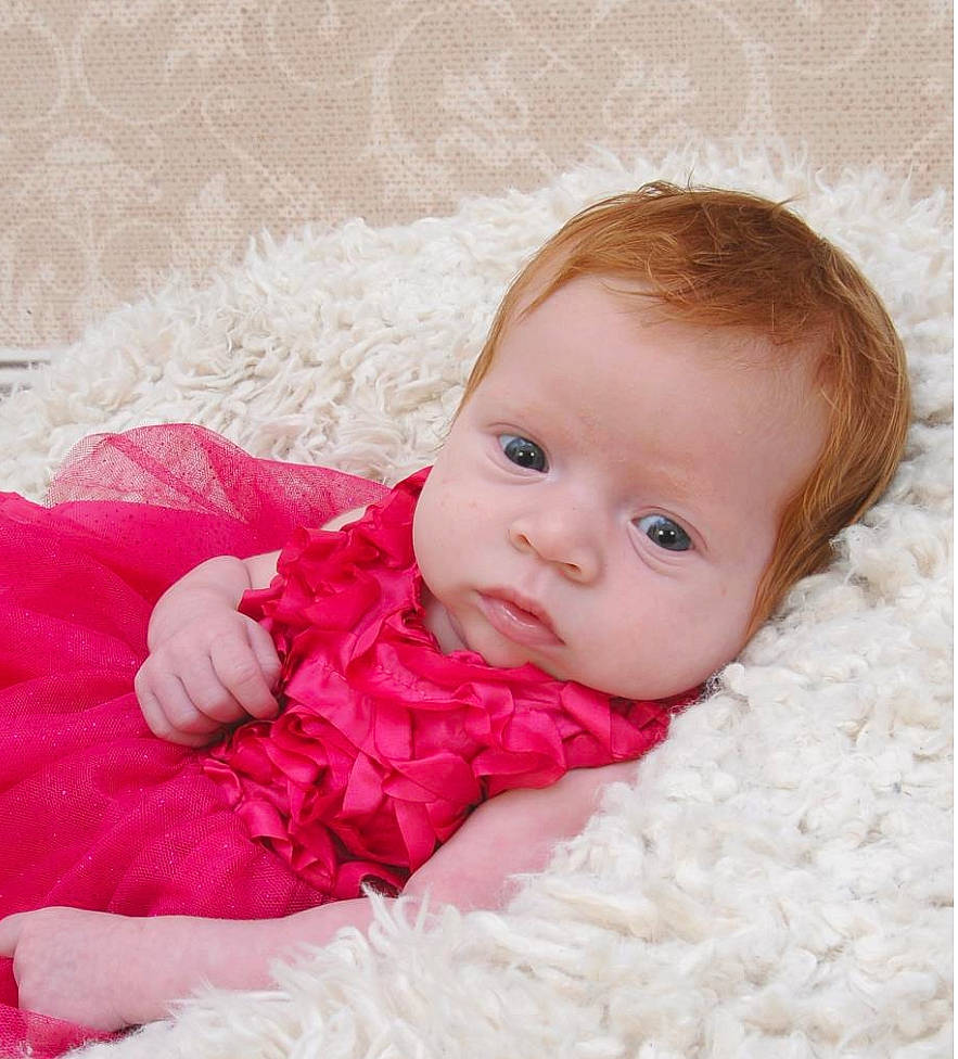 Alaina is registered to the contest to win money with this photo: baby, beauty, blanket, cheek, child, eye, face, fur, head, iris, lip, mouth, nose, person, photograph, photography, pink, product, skin, textile