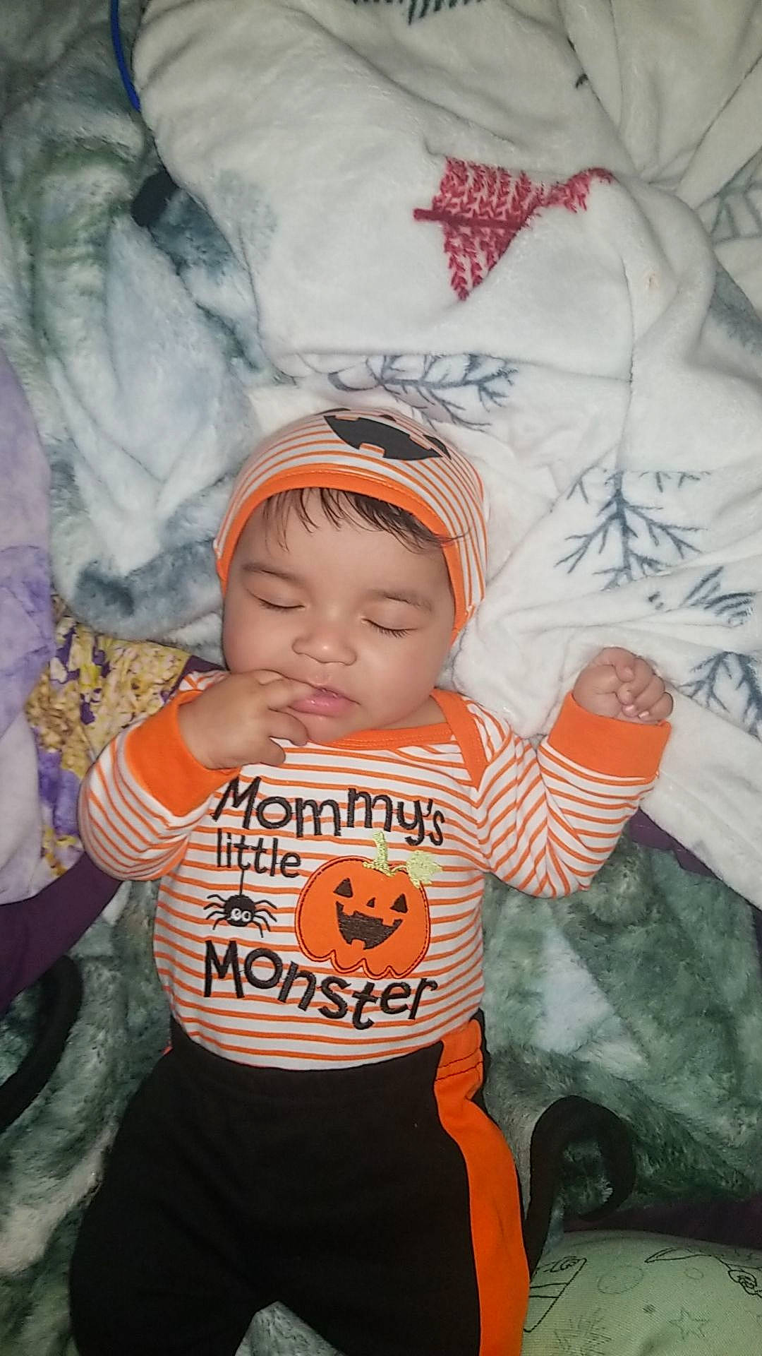 Marcellus is registered to the contest to win money with this photo: baby, baby_products, baby_toddler_clothing, cap, cheek, child, comfort, eye, fun, happy, head, headwear, linens, mouth, organ, person, personal_protective_equipment, skin, sleeve, t_shirt