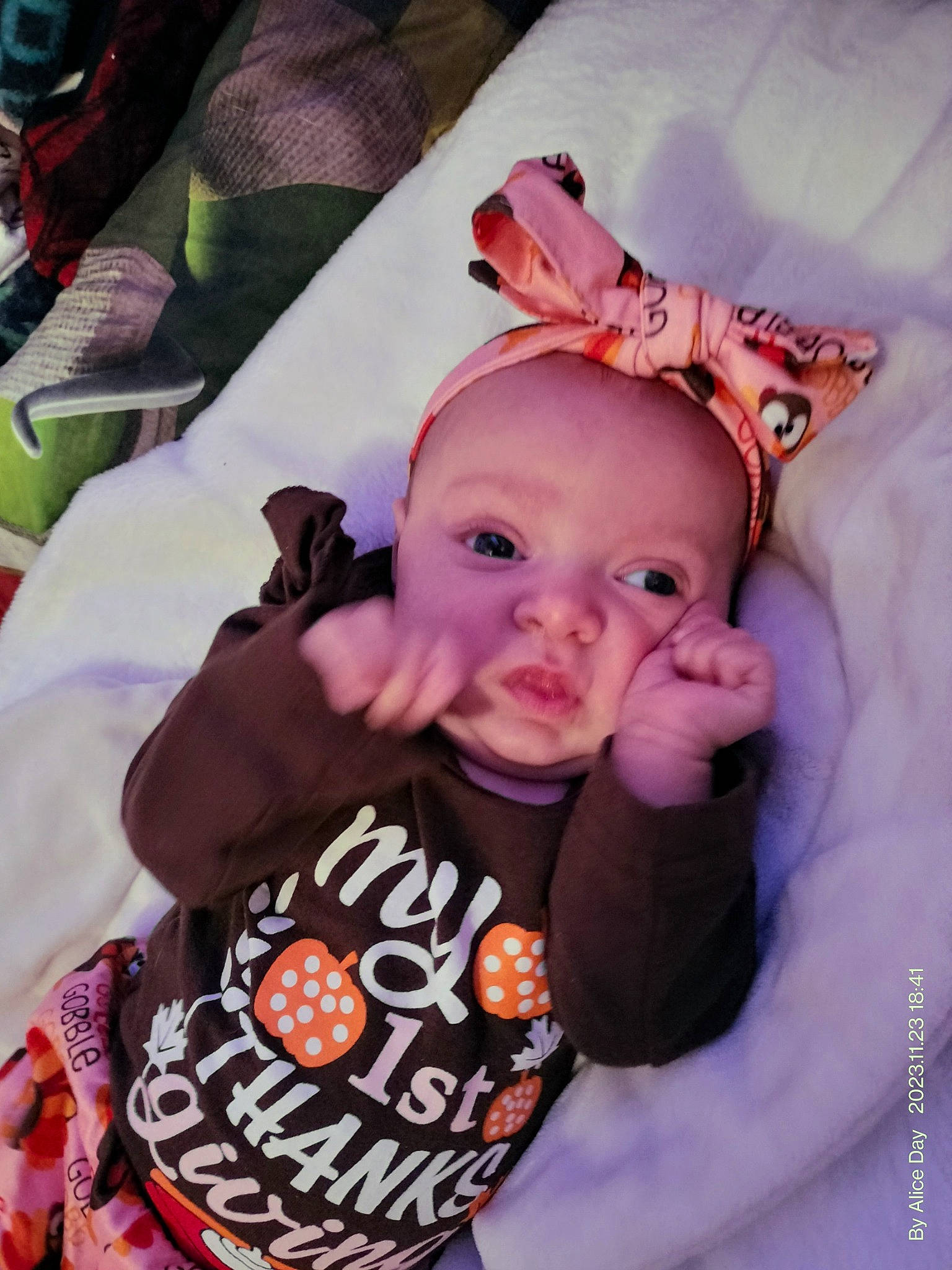 Maci is registered to the contest to win money with this photo: baby, baby_products, baby_toddler_clothing, cheek, child, ear, eyelash, fashion_accessory, finger, fun, happy, lip, magenta, neck, person, pink, sitting, skin, sleeve, t_shirt
