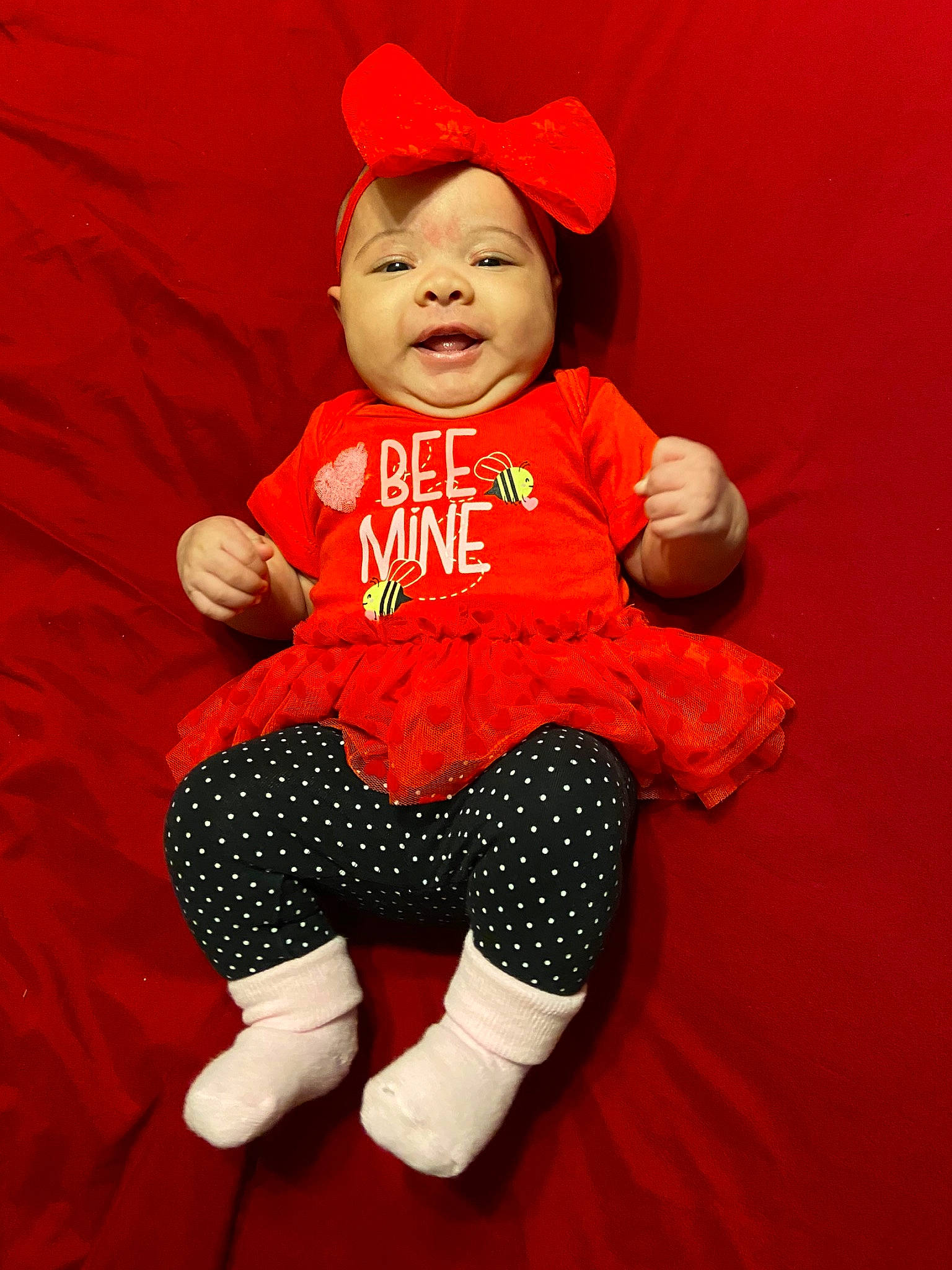 Harris is registered to the contest to win money with this photo: baby, baby_toddler_clothing, child, headwear, orange, person, red, toddler