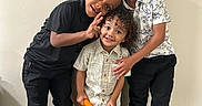 Carter is registered to the contest to win money with this photo: casual_clothing, children, colorful_sneakers, eyeglasses, family, friendship, group_portrait, happy, hardwood_floor, indoor, kids, peace_sign, photography, playful, portrait, siblings, smiling, standing, wall, young_people