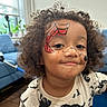 Carter joined the competition — help win amazing prizes! child, portrait, curly_hair, face_paint, superhero, spiderman, dinosaur, t_shirt, smiling, indoors, living_room, couch, window, daylight, close_up, person, young, playful, casual_clothing, photography