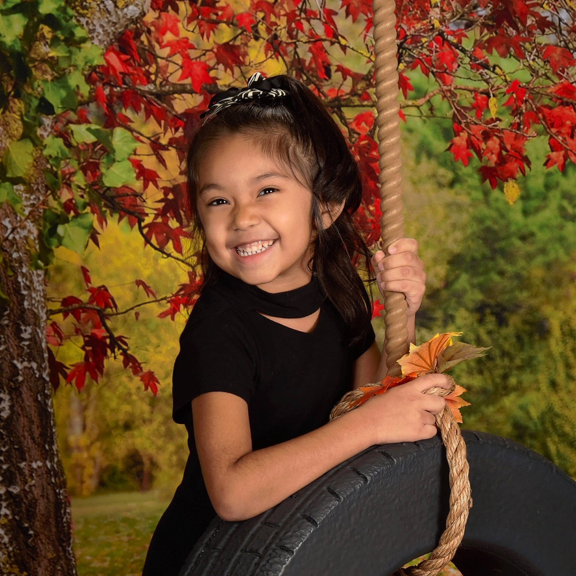 Alanie is registered to the contest to win money with this photo: autumn, black_hair, blurred, child, eye, girl, happiness, joy, leaf, person, plant, portrait_photography, smile, toddler, tree
