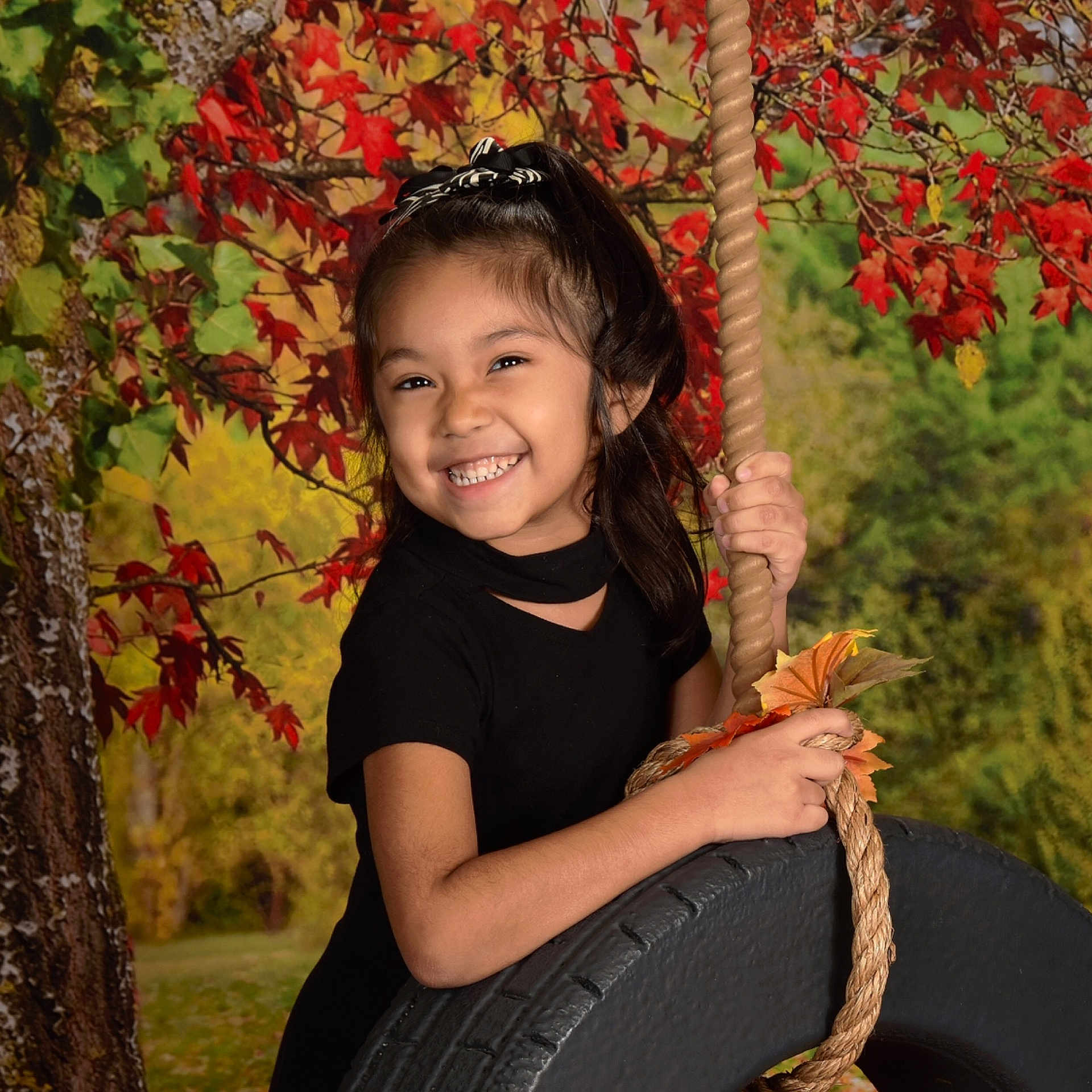 Alanie is registered to the contest to win money with this photo: autumn, black_hair, blurred, child, eye, girl, happiness, joy, leaf, person, plant, portrait_photography, smile, toddler, tree