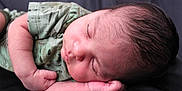 Raymond is registered to the contest to win money with this photo: cheek, child, ear, finger, hand, infant, mouth, nap, sleep, toddler