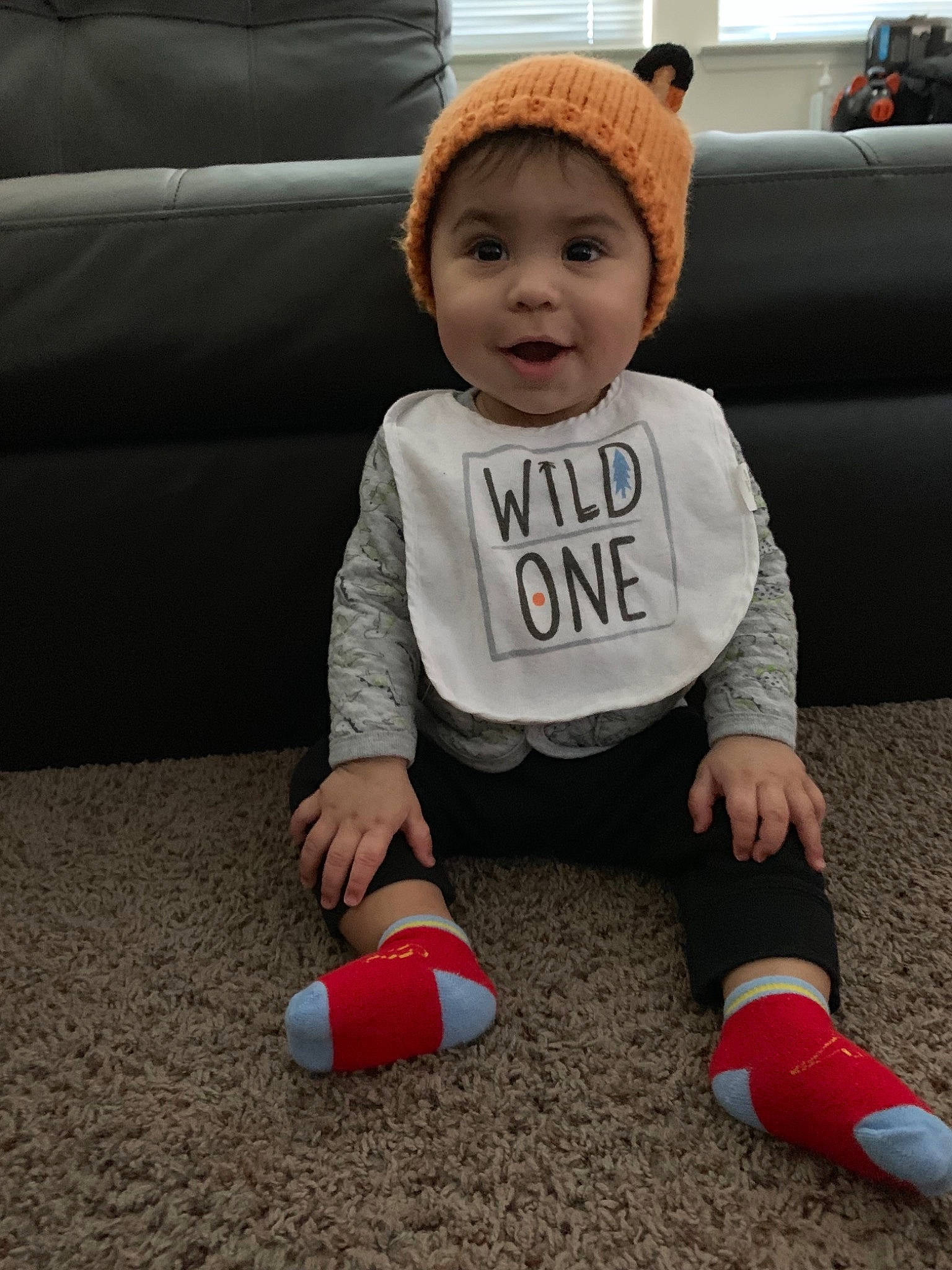 Raymond joined the competition — help win amazing prizes! baby, cap, child, fictional_character, footwear, fun, headgear, outerwear, person, play, red, shoe, sitting, skin, sleeve, smile, t_shirt, toddler