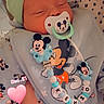 Kenzo participe au concours pour gagner de l'argent avec cette photo : baby, newborn, pacifier, hat, sleeping, mickey_mouse, clothing, cute, infant, bed, blanket, child, toy, accessory, peaceful, soft_lighting, indoors, closeup, person, pink_heart