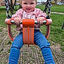 Lyanna joined the competition — help win amazing prizes! child, toddler, swing, playground, outdoor, park, grass, trees, clothing, pink, blue_jeans, happy, smiling, person, daylight, casual, fun, feet, socks, residential_area