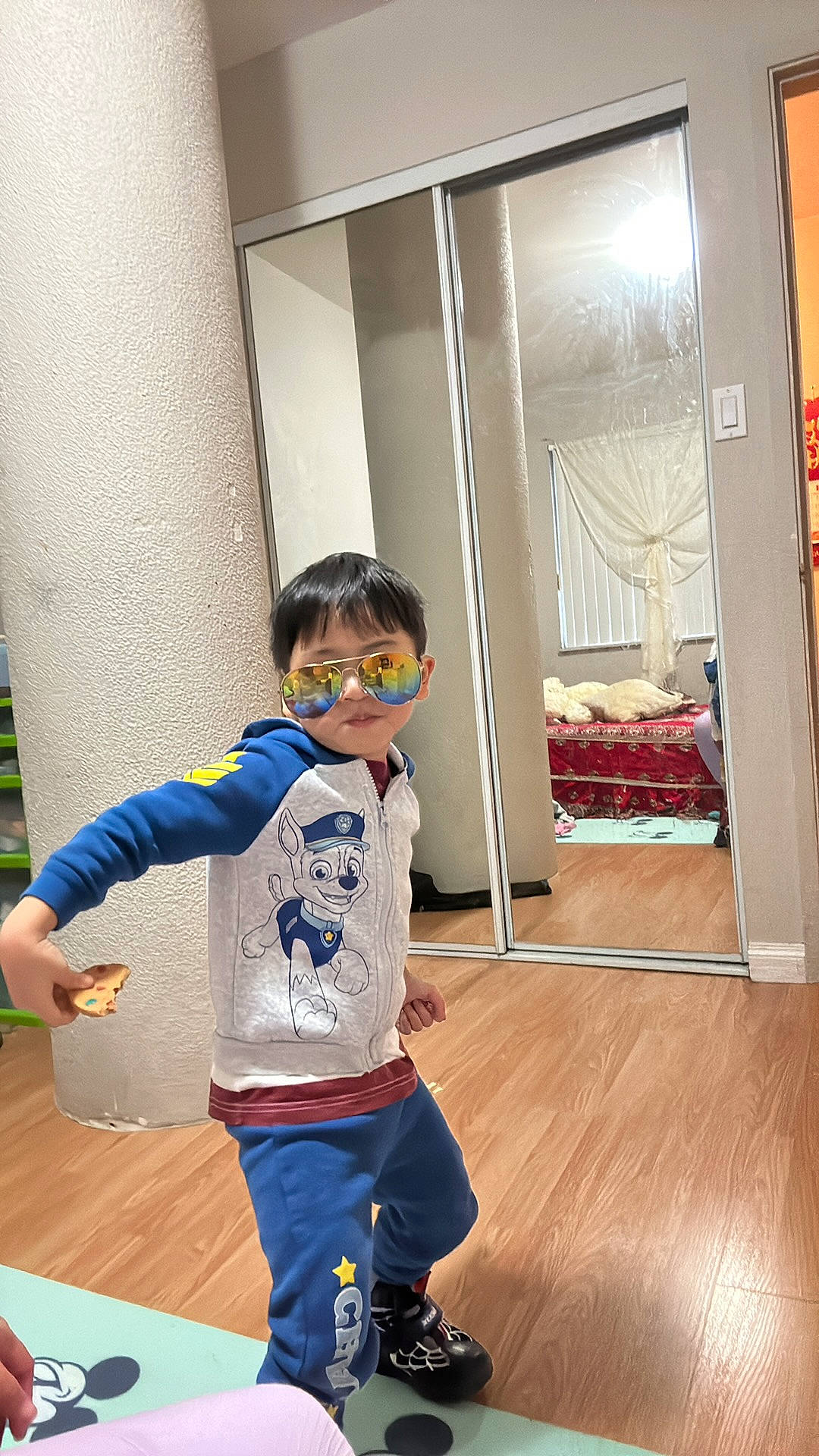 Theseus is registered to the contest to win money with this photo: baby_toddler_clothing, child, electric_blue, eyewear, floor, flooring, fun, hardwood, laminate_flooring, leisure, person, personal_protective_equipment, play, shorts, sleeve, t_shirt, toddler, varnish, wood, wood_flooring