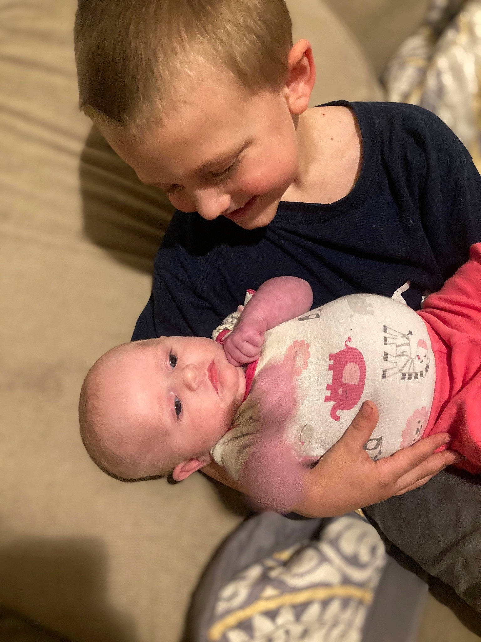 Aiden is registered to the contest to win money with this photo: abdomen, baby, baby_toddler_clothing, cheek, chest, child, comfort, elbow, face, hair, hairstyle, happy, head, human_body, mouth, person, sitting, skin, sleeve, stomach