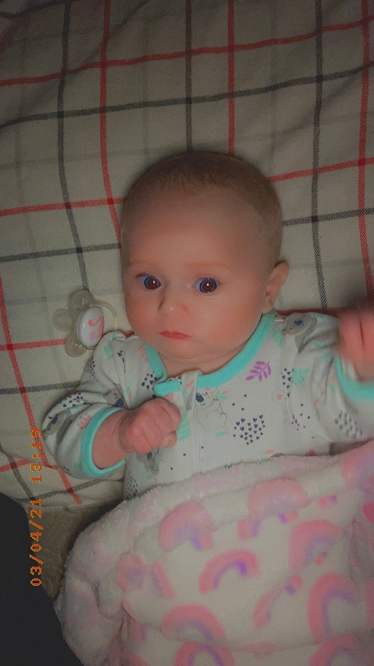 Austyn joined the competition — help win amazing prizes! baby, baby_toddler_clothing, cheek, child, chin, comfort, eye, eyebrow, head, infant_bed, iris, linens, lip, mouth, nose, person, pink, skin, sleeve, tartan