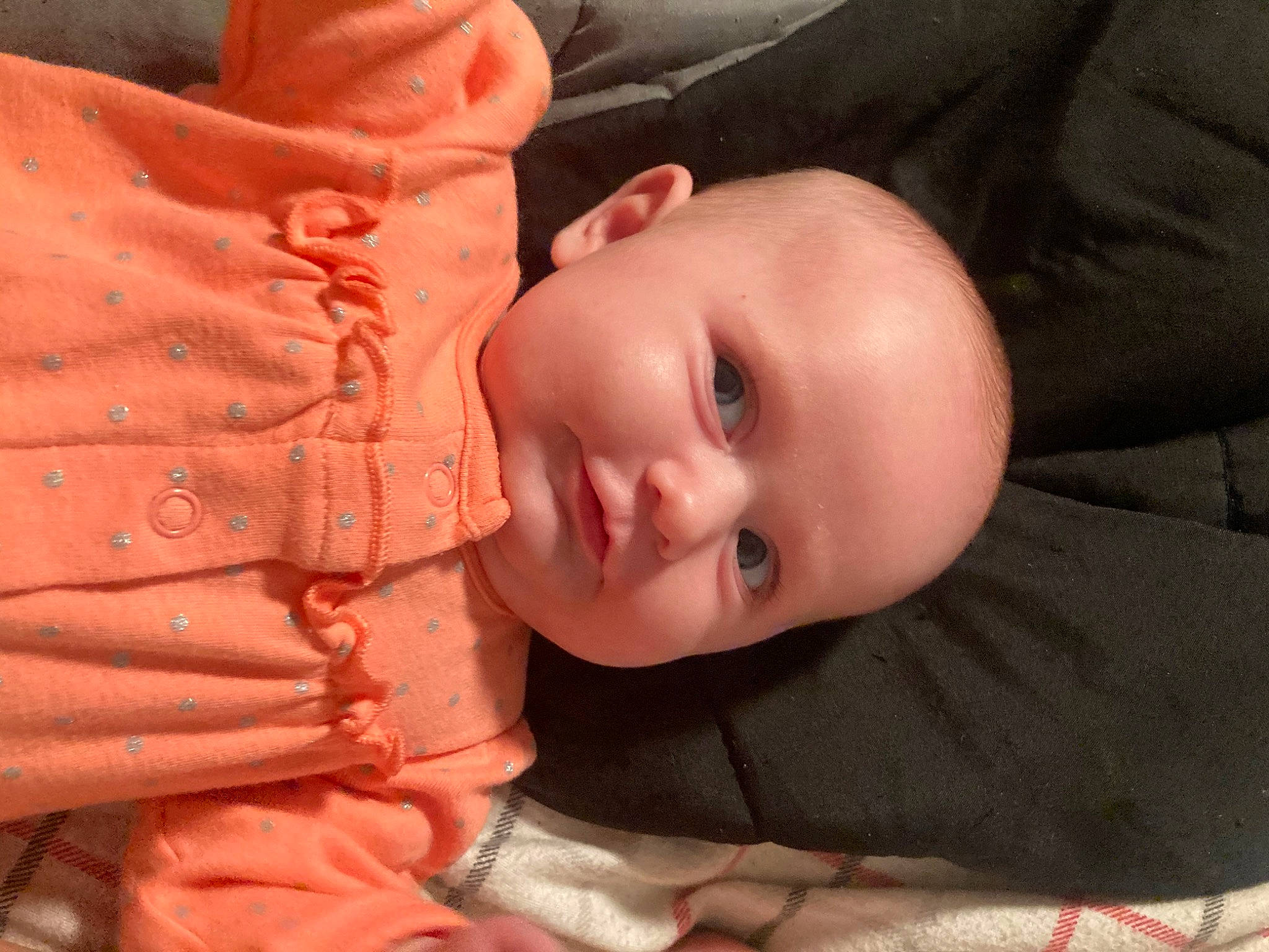 Austyn is registered to the contest to win money with this photo: baby, baby_toddler_clothing, cheek, chin, comfort, eye, eyebrow, facial_expression, head, human_body, iris, lip, mouth, nose, outerwear, person, product, skin, sleeve, smile