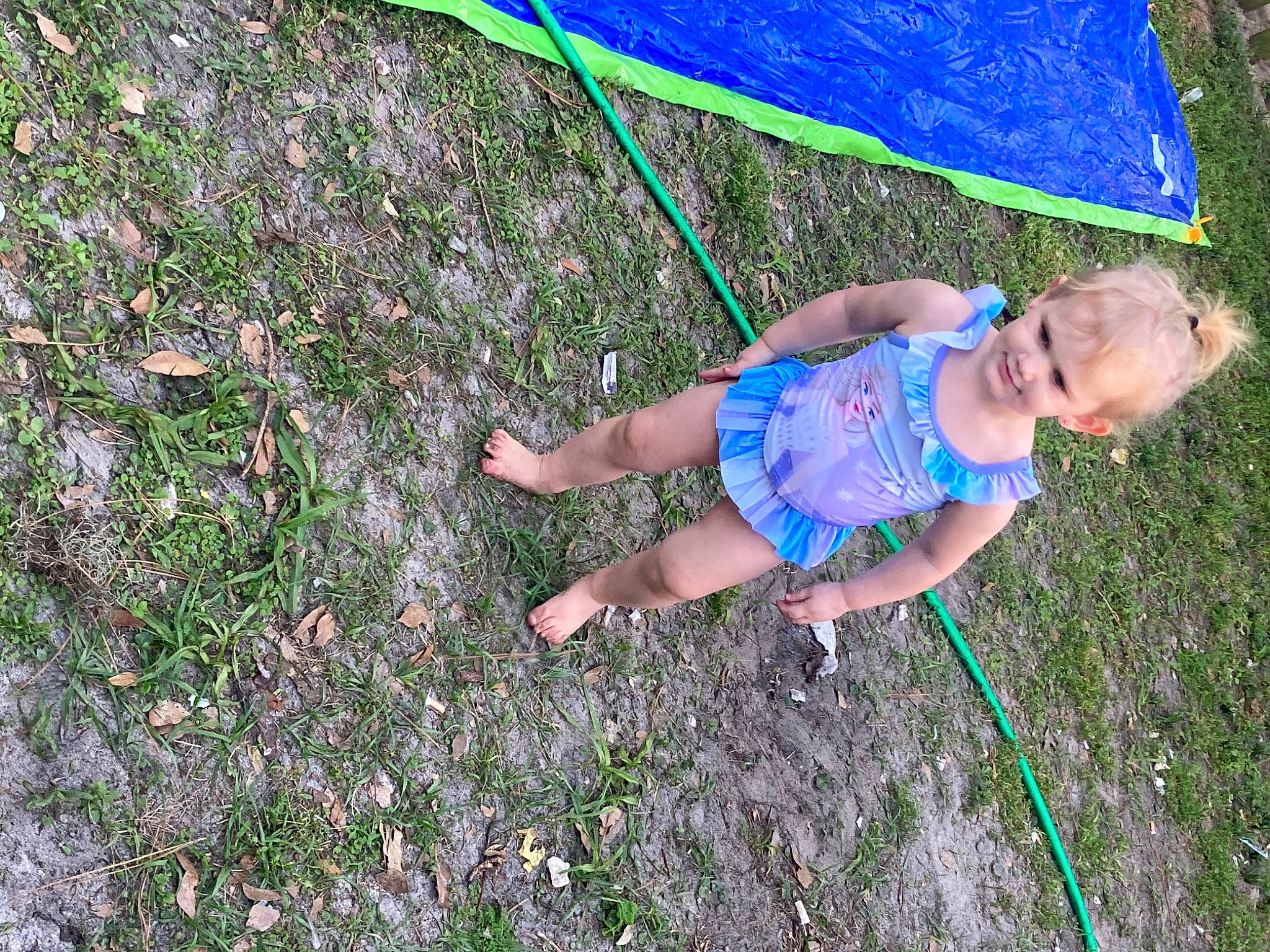 Adalyn joined the competition — help win amazing prizes! baby_toddler_clothing, barefoot, electric_blue, fun, grass, grass_family, grassland, groundcover, happy, joy, lawn, leaf, leisure, people_in_nature, person, plant, play, recreation, smile, toddler