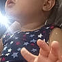 Ayanah joined the competition — help win amazing prizes! baby, child, face, hand, curly_hair, star_pattern, clothing, portrait, closeup, skin, eyes, expression, indoor, person, infant, cute, young_child, soft_light, casual, apparel