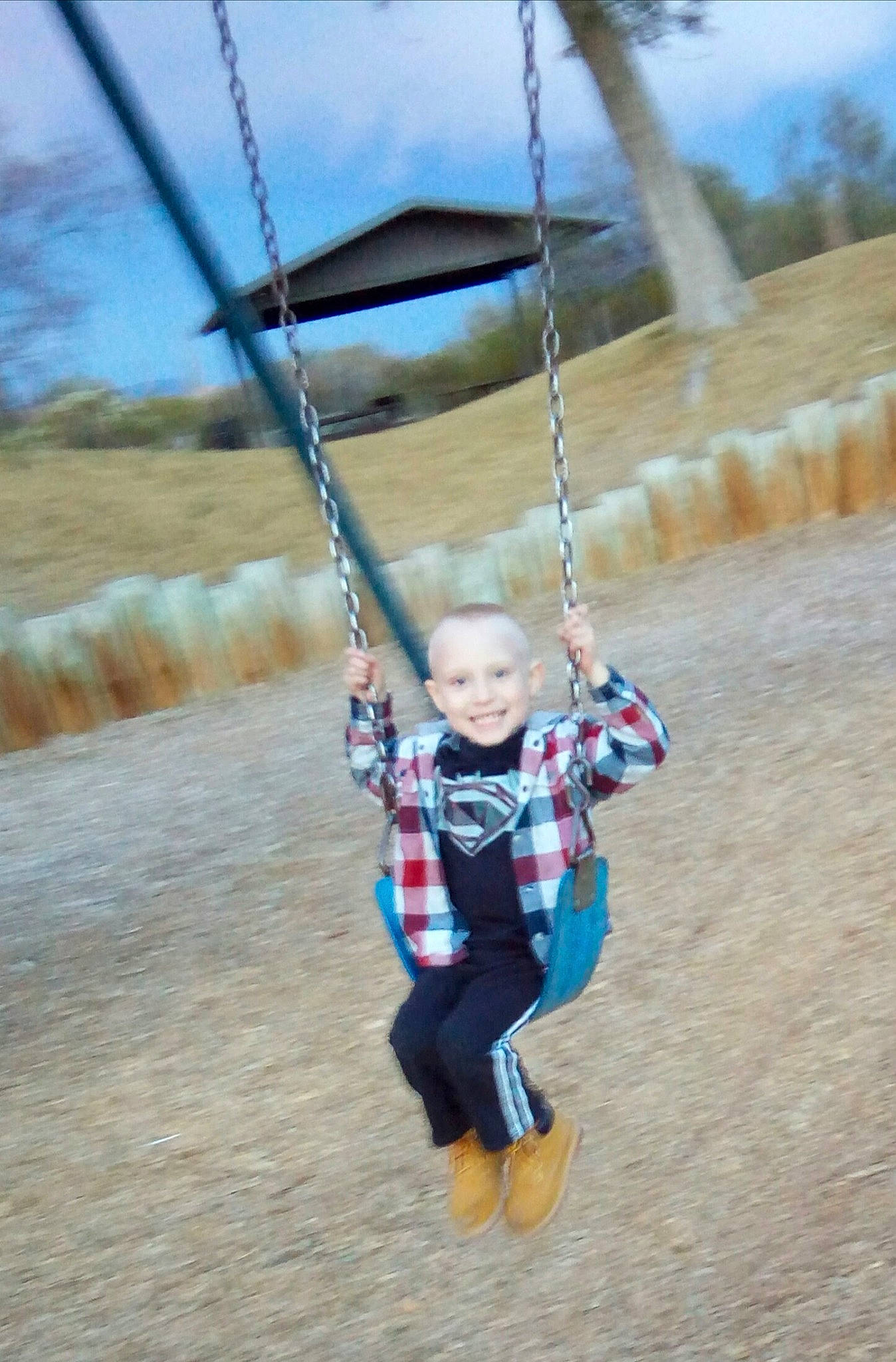 Gavyn is registered to the contest to win money with this photo: adventure, fun, joy, outdoor_play_equipment, person, play, playground, recreation, rope, swing, toddler, vacation
