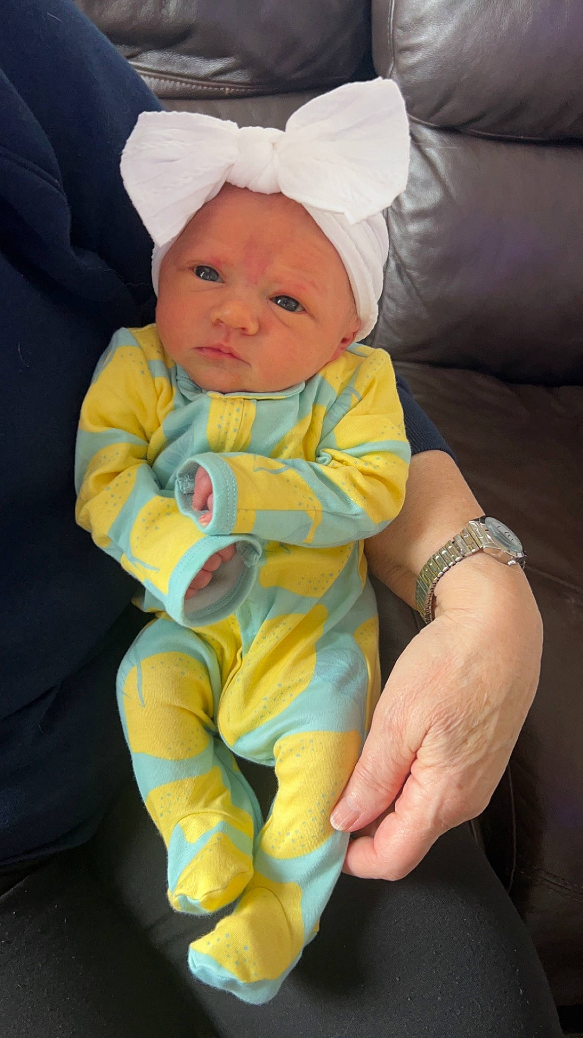 Delilah is registered to the contest to win money with this photo: baby, baby_products, baby_toddler_clothing, child, comfort, event, finger, fun, gesture, hand, happy, hat, lap, person, sitting, sleeve, smile, thumb, toddler, watch