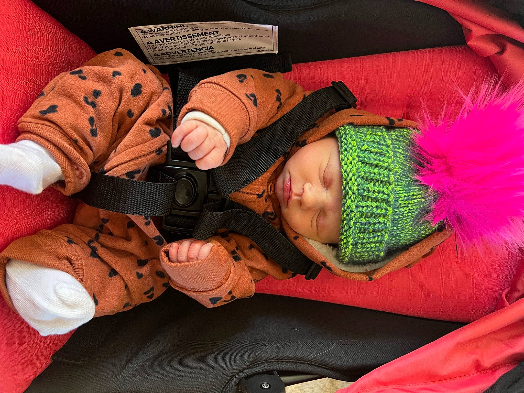 Delilah is registered to the contest to win money with this photo: baby, baby_products, carmine, child, comfort, costume, event, eyelash, fashion_accessory, feather, fun, glove, headgear, headwear, human_leg, magenta, nail, pattern, peach, person